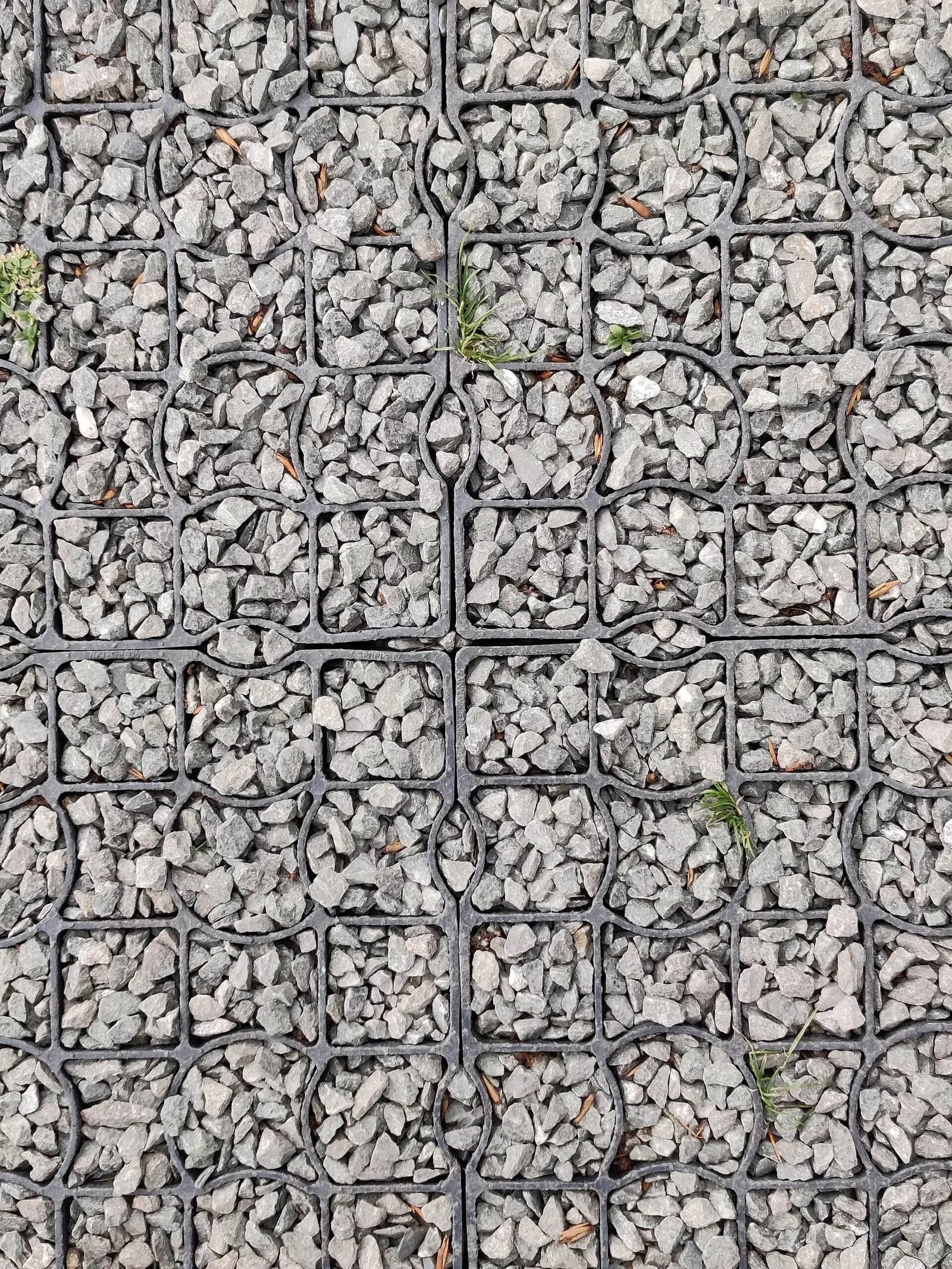 Plastic gravel grid filled with angular aggregate