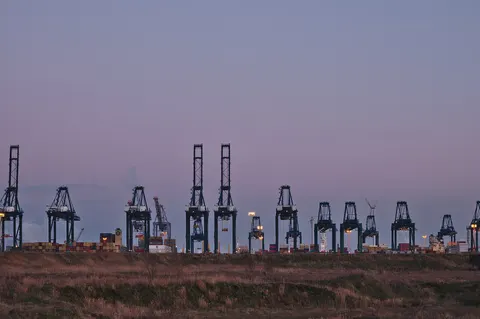 Container terminal cranes at dusk