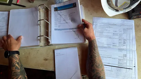 Inspection checklist and records on a clipboard