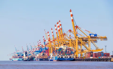 Ship-to-shore cranes loading a container vessel